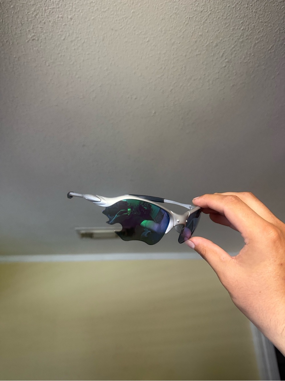 Oakley Silver Frame Sunglasses with Green Mirrored Lenses